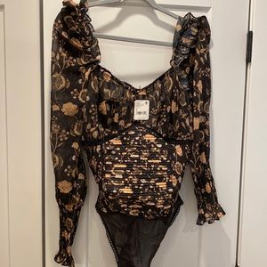 Free people bodysuit never been worn- tags still on